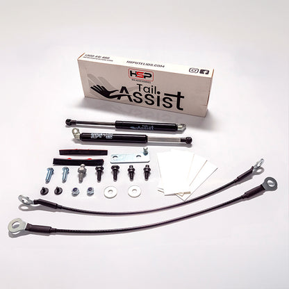 HSP Tail Assist kit components including struts, brackets, bolts and installation hardware laid out on white background