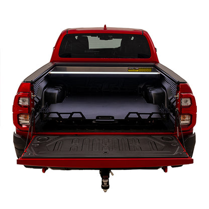 Red Toyota Hilux SR5 with HSP load slide tucked in, straight rear view