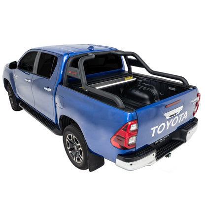 Blue Toyota Hilux SR5 with roll top and roller cover open rear three-quarter view