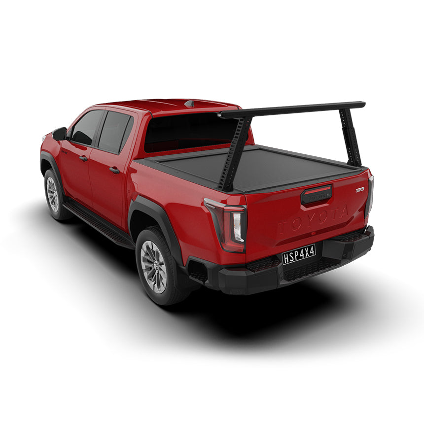 Single rear HSP Load Rack Pro fitted to a Red 2026 Toyota Hilux, rear 3/4 angle also featuring a sleek HSP Electric Roller Cover