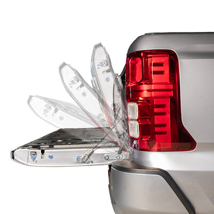 Tailgate Struts: HSP Tail Assist fitted to the tailgate for controlled opening on a Mitsubishi Triton