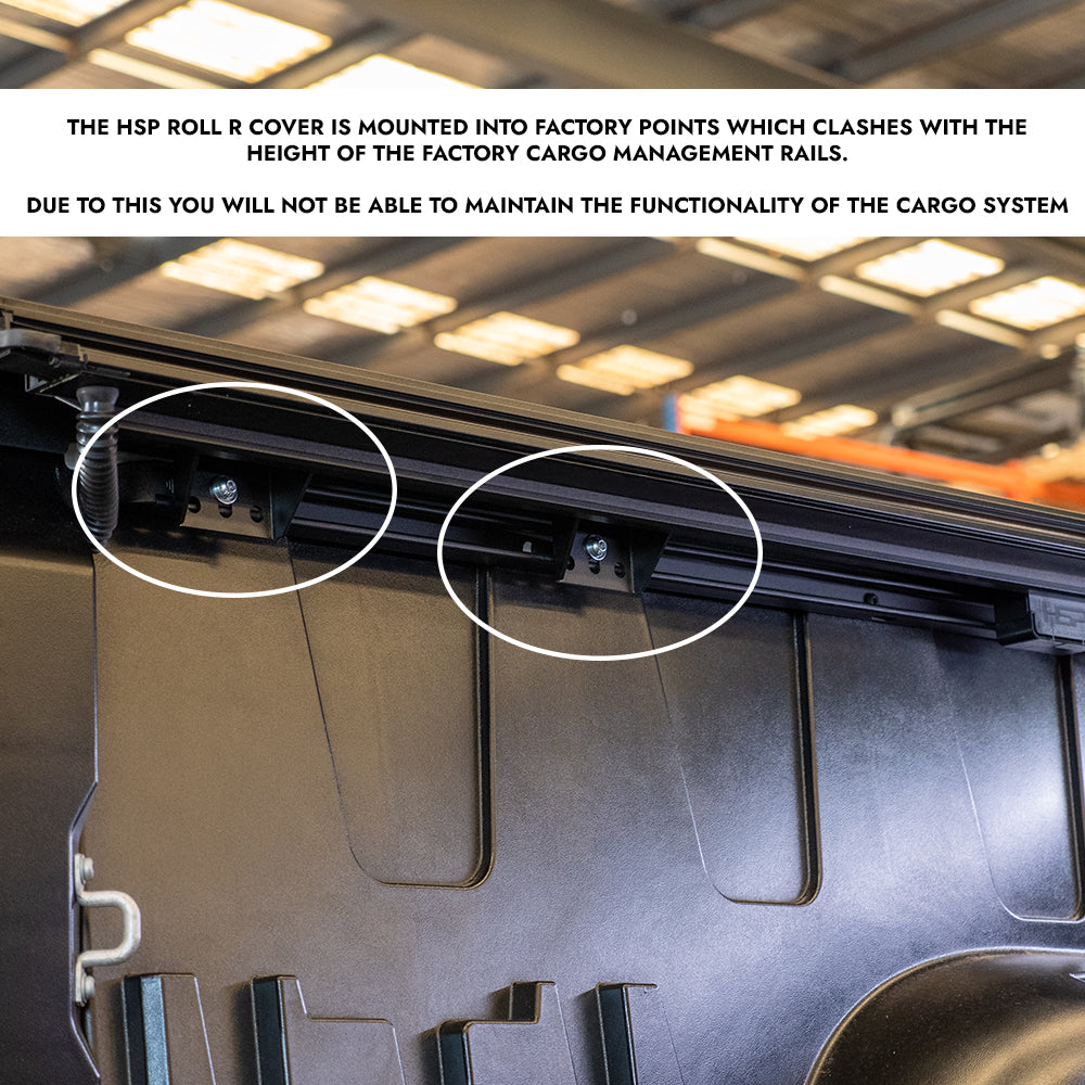 Close up of HSP Roller Cover mounting points inside tub rail, showing brackets that interfere with factory cargo management rails and affect system functionality