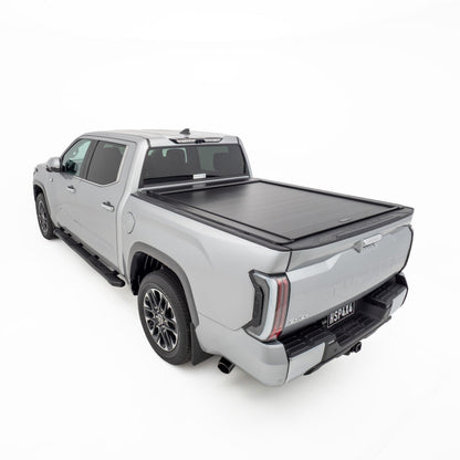 Rear three quarter view of silver Toyota Tundra showing closed HSP Roller Cover